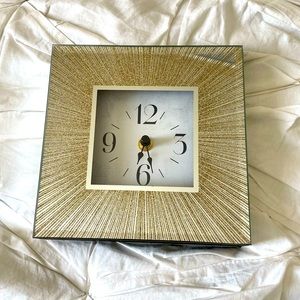 Beautiful clock with gold accents and mirror sides